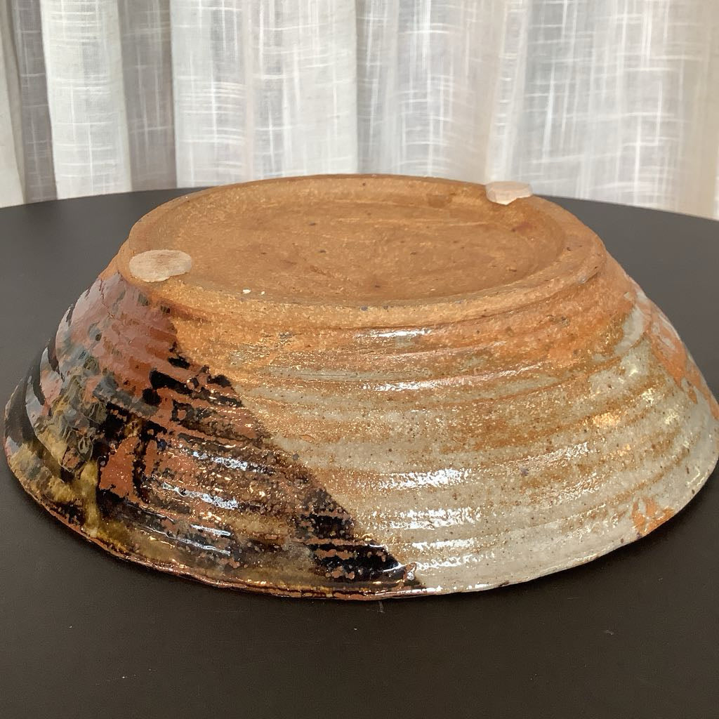 View of side and bottom of the clay bowl 