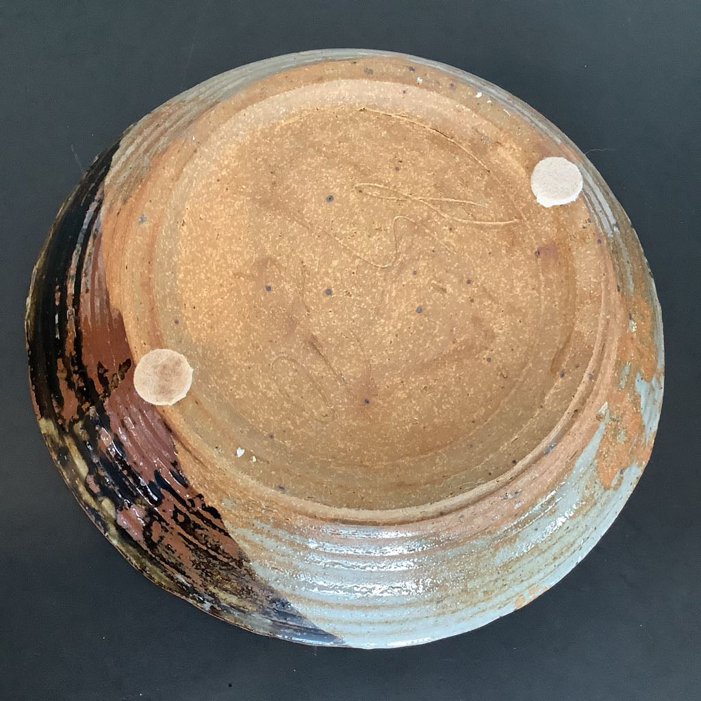 Bottom of pottery bowl with two felt stands