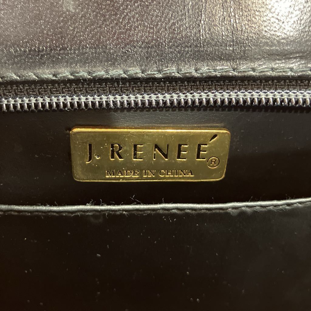 J. Renee logo on a black leather product with gold label