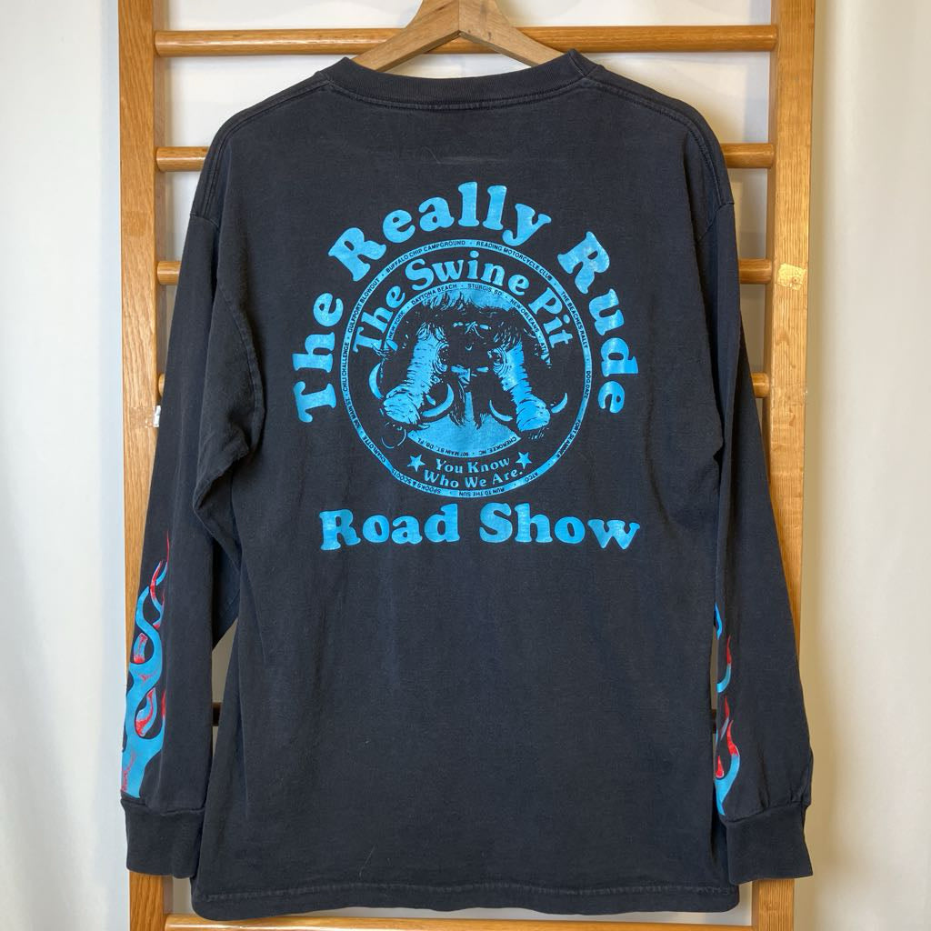 Black long-sleeve shirt with blue graphic design on a wooden hanger
