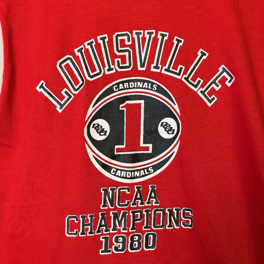 Red t-shirt with 'Louisville Cardinals NCAA Champions 1980' text and logo.