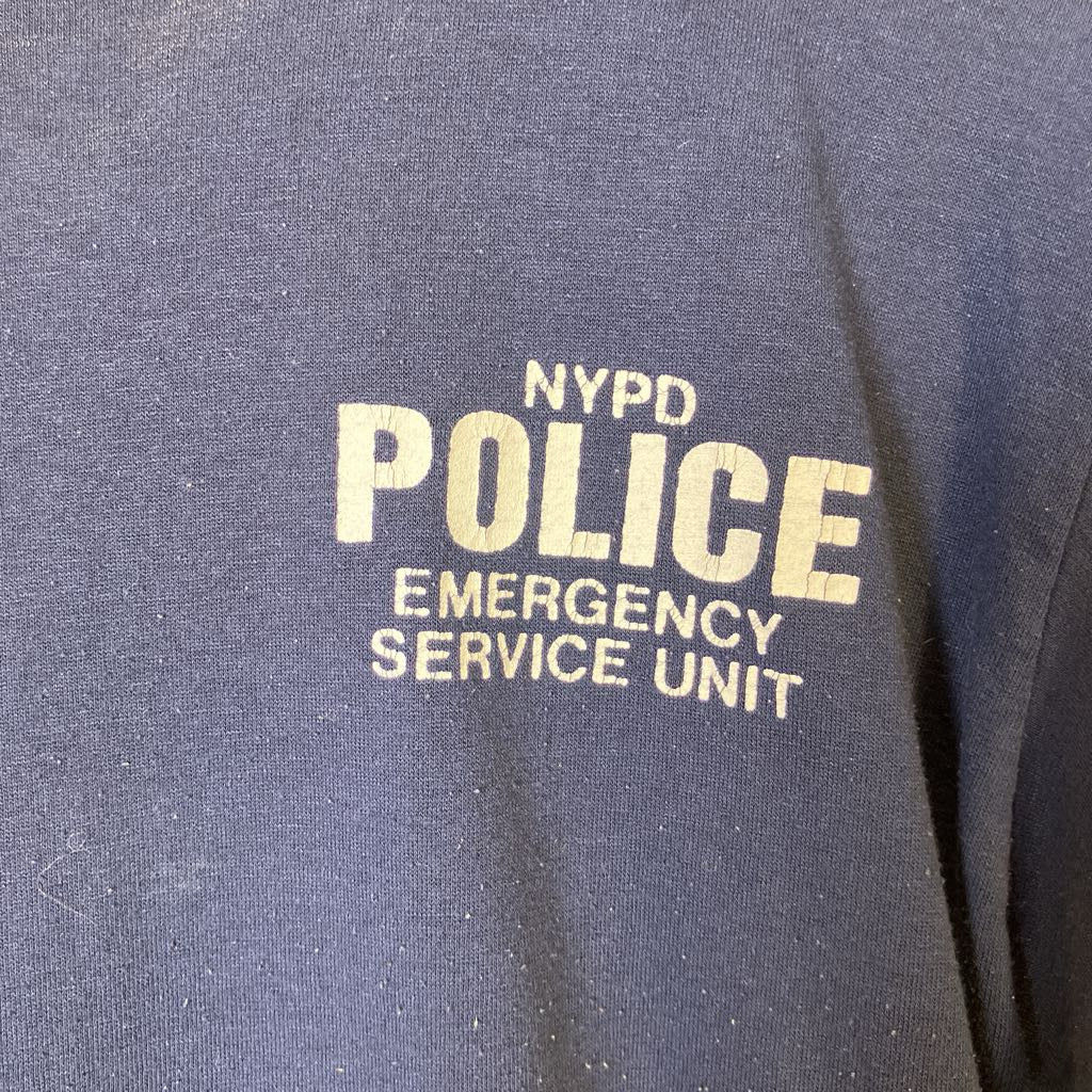 NYPD Police Emergency Service Unit text on a dark background