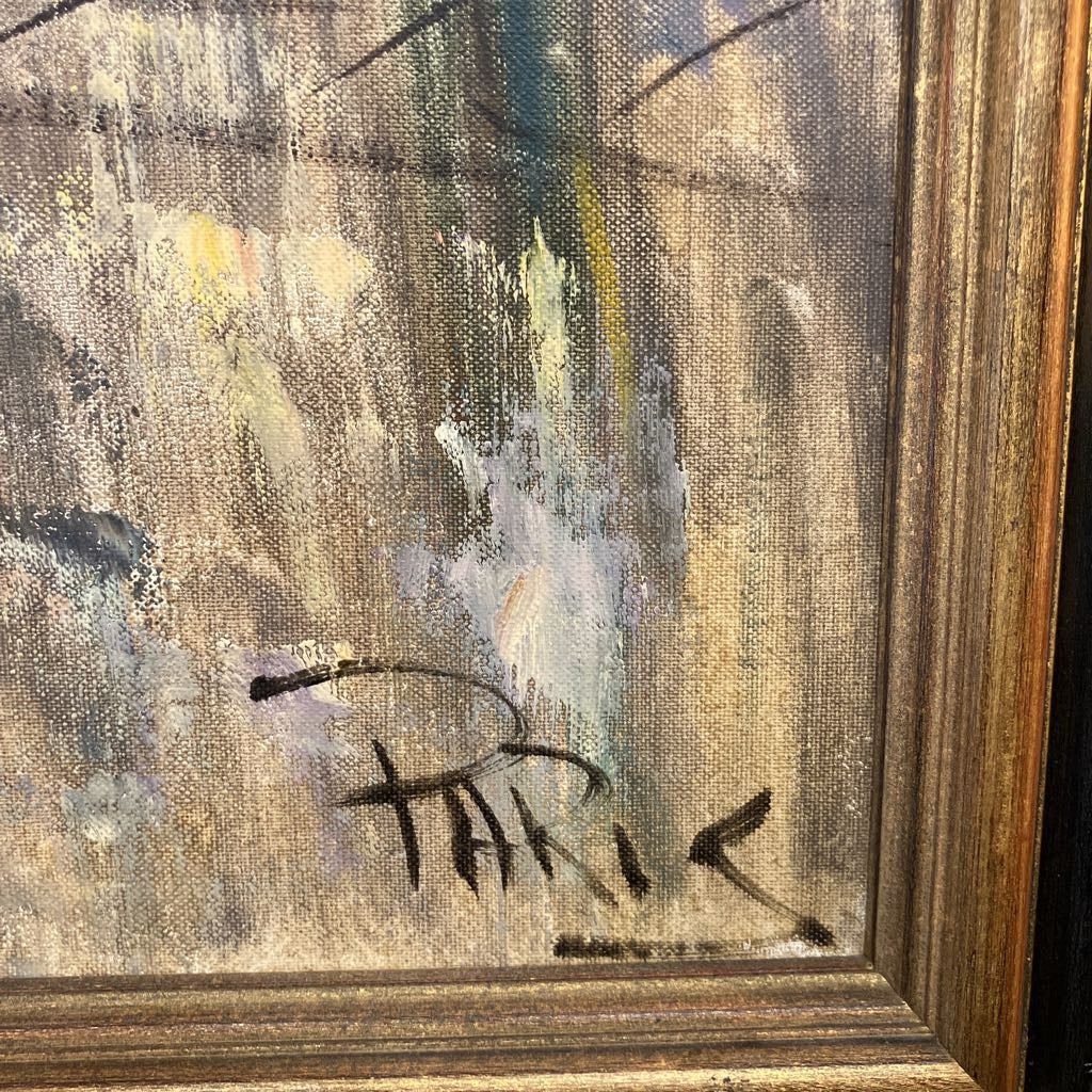 Abstract painting with a signature in a wooden frame