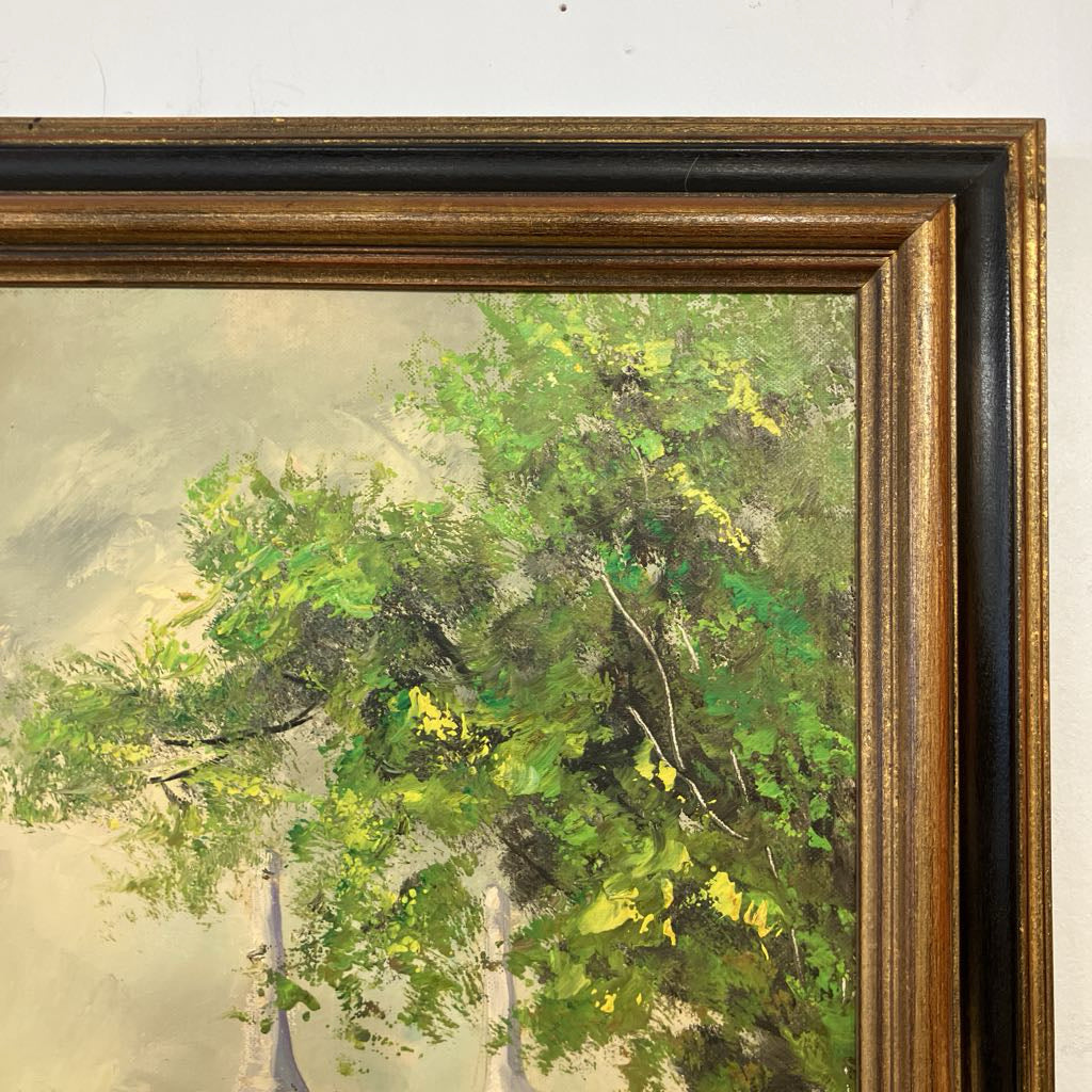 Framed painting of a landscape with green and yellow tones.