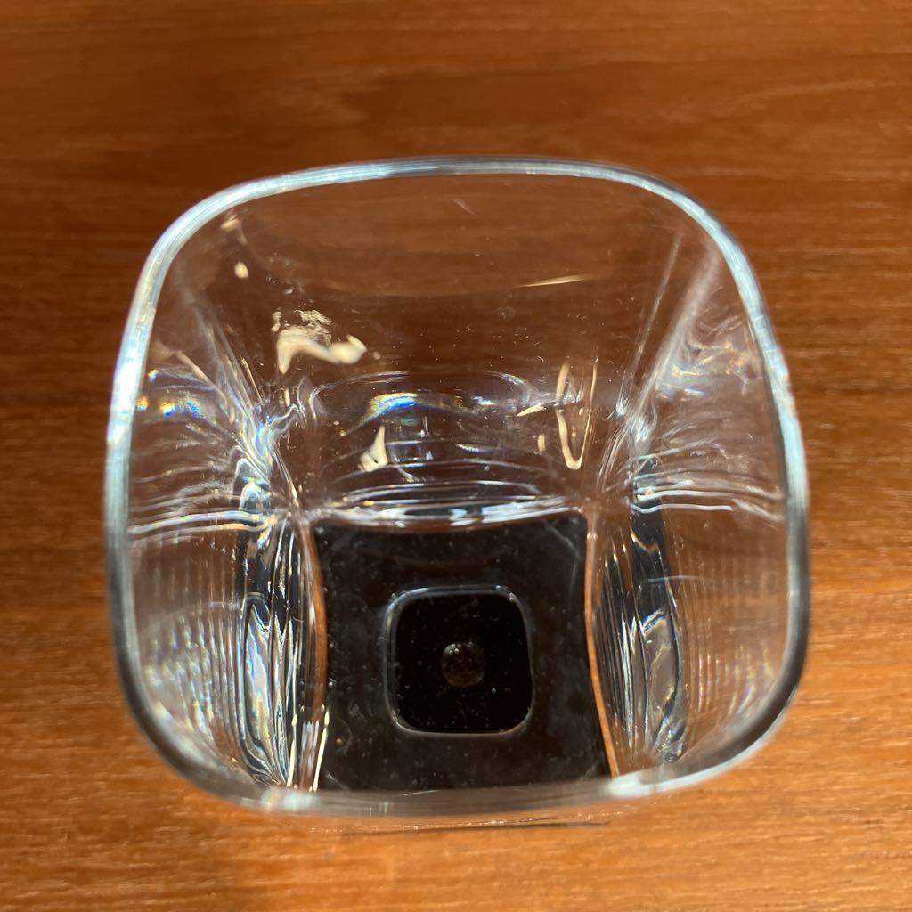 Clear glass tumbler on a wooden surface