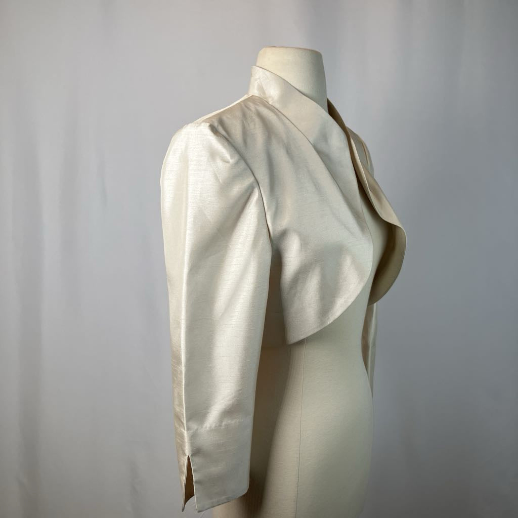 Mannequin wearing a cream-colored jacket against a plain background