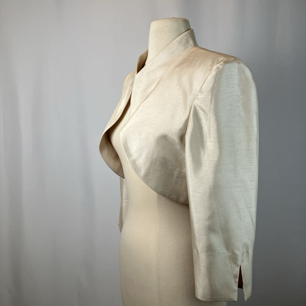 Beige blazer on a mannequin against a gray background