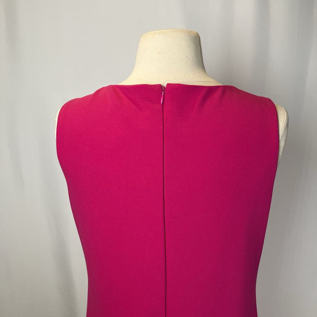 Pink drop waist dress on a mannequin against a white background. 