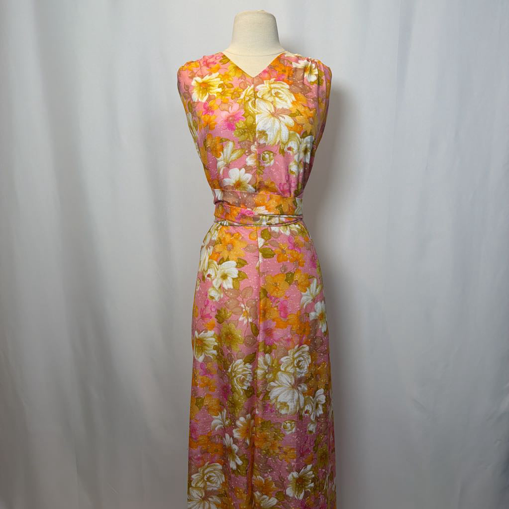 Floral dress on a mannequin against a plain background