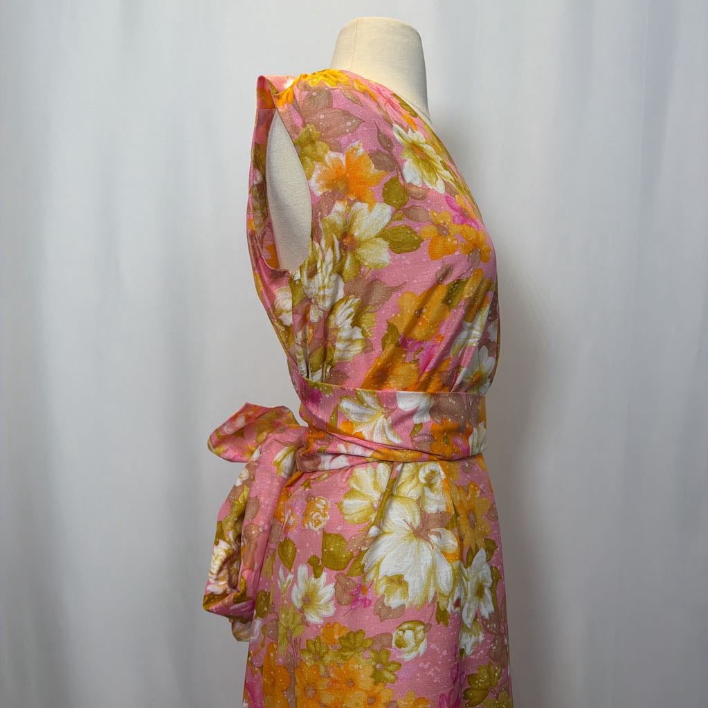 Floral dress on a mannequin against a white background