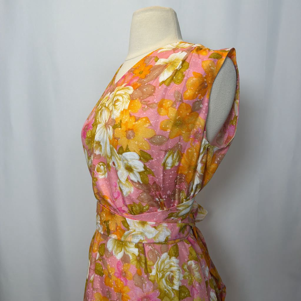 Floral dress on a mannequin against a plain background