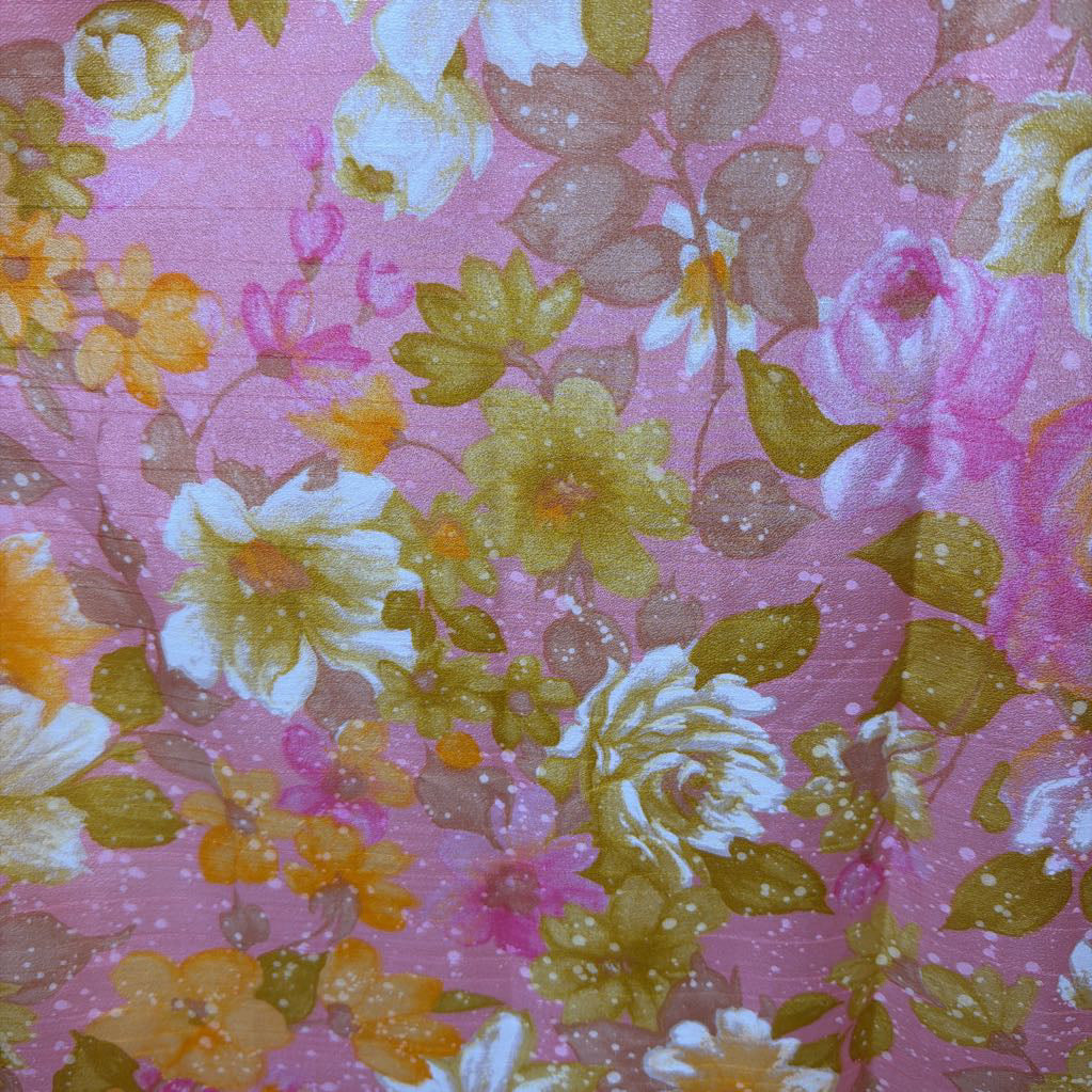 Floral pattern on fabric with pink background