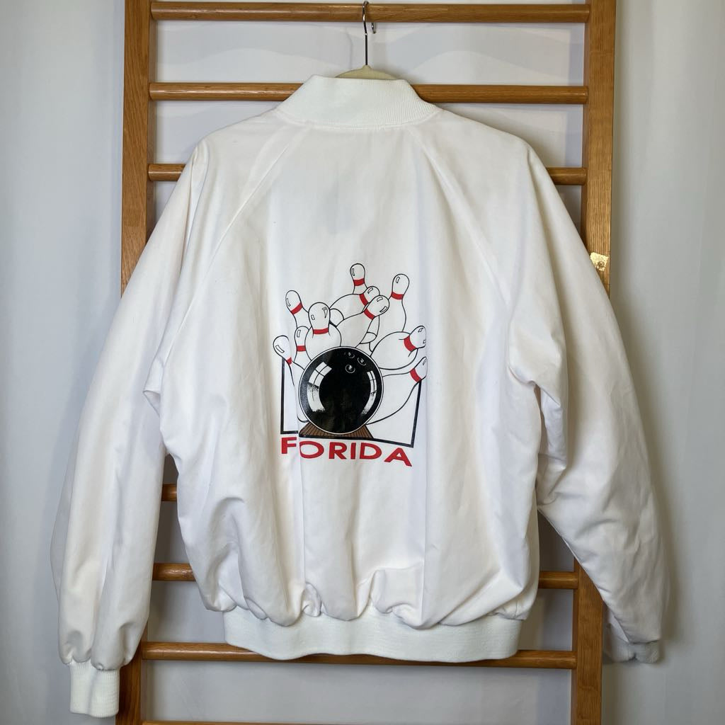 White jacket with bowling design and 'Florida' text on a wooden rack.