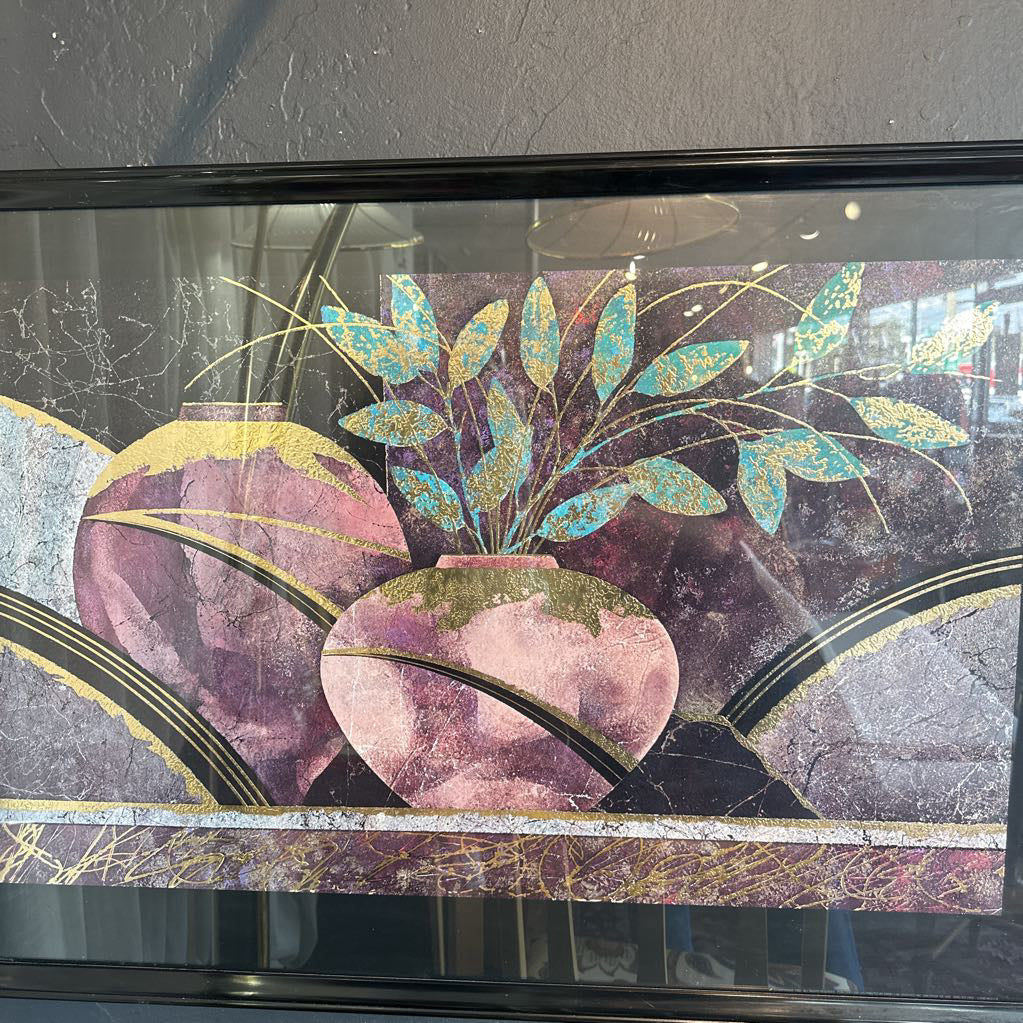 Decorative glass panel with floral design and purple pots on a textured wall.