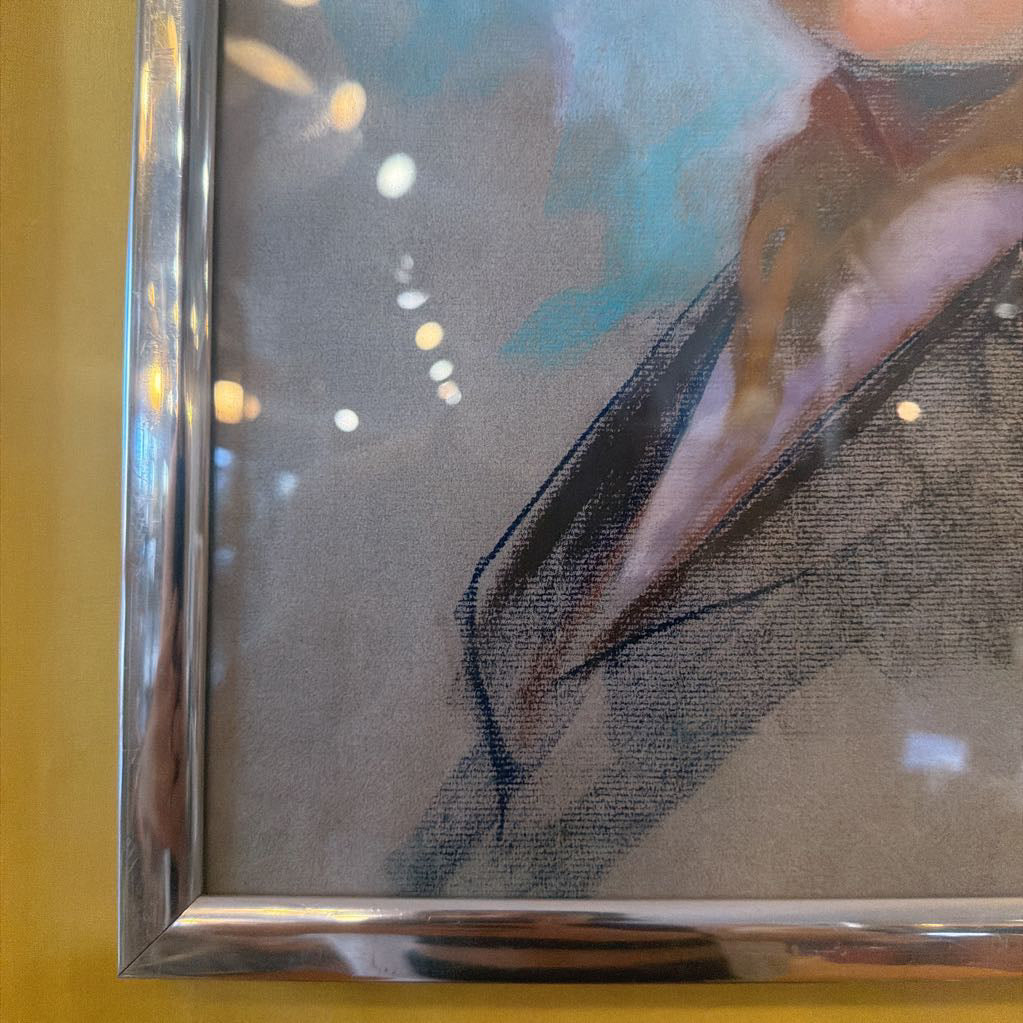 Framed painting of a horse on a yellow wall