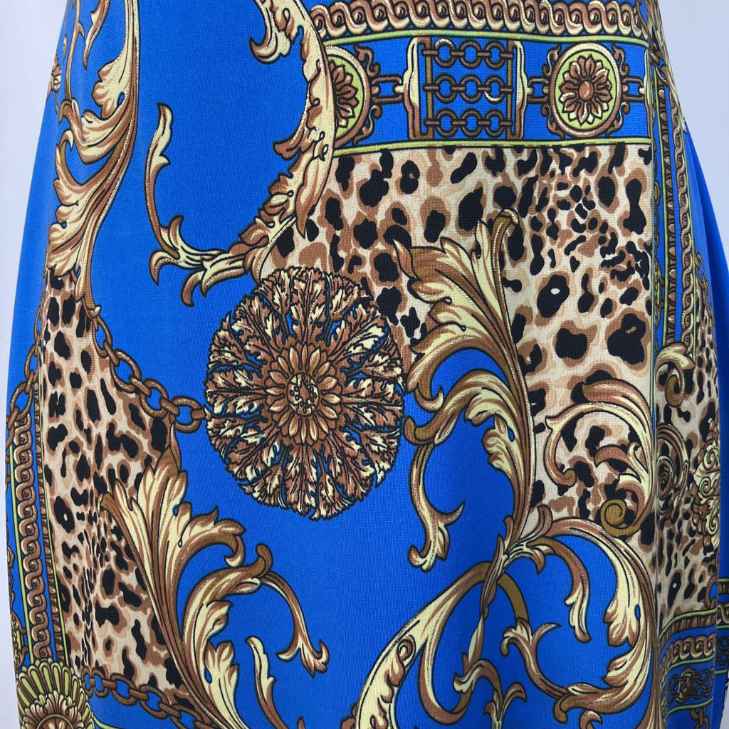 Patterned fabric with leopard print, gold accents, and blue background