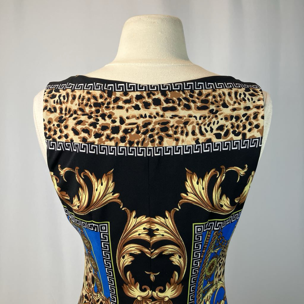 Mannequin wearing a dress with leopard print and baroque-style patterns on a plain background