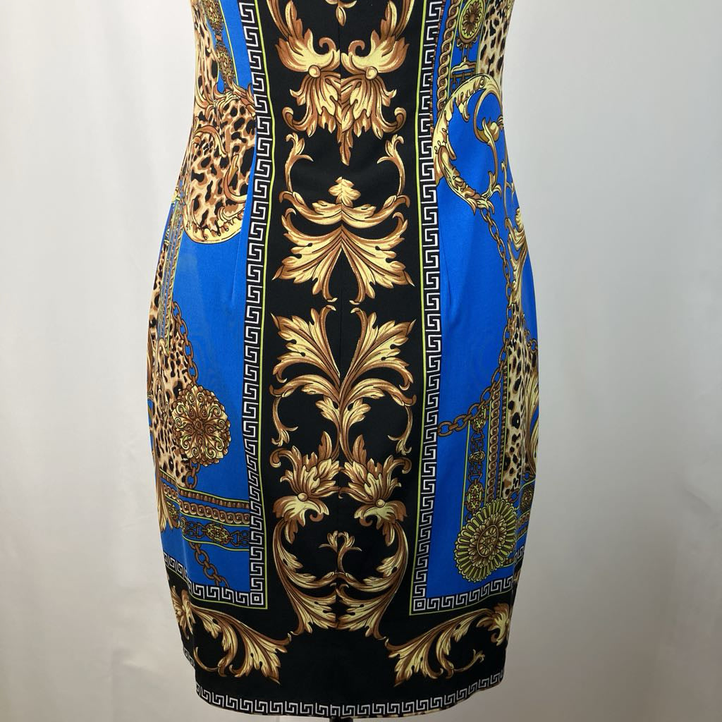Patterned dress with gold and blue design on a plain background