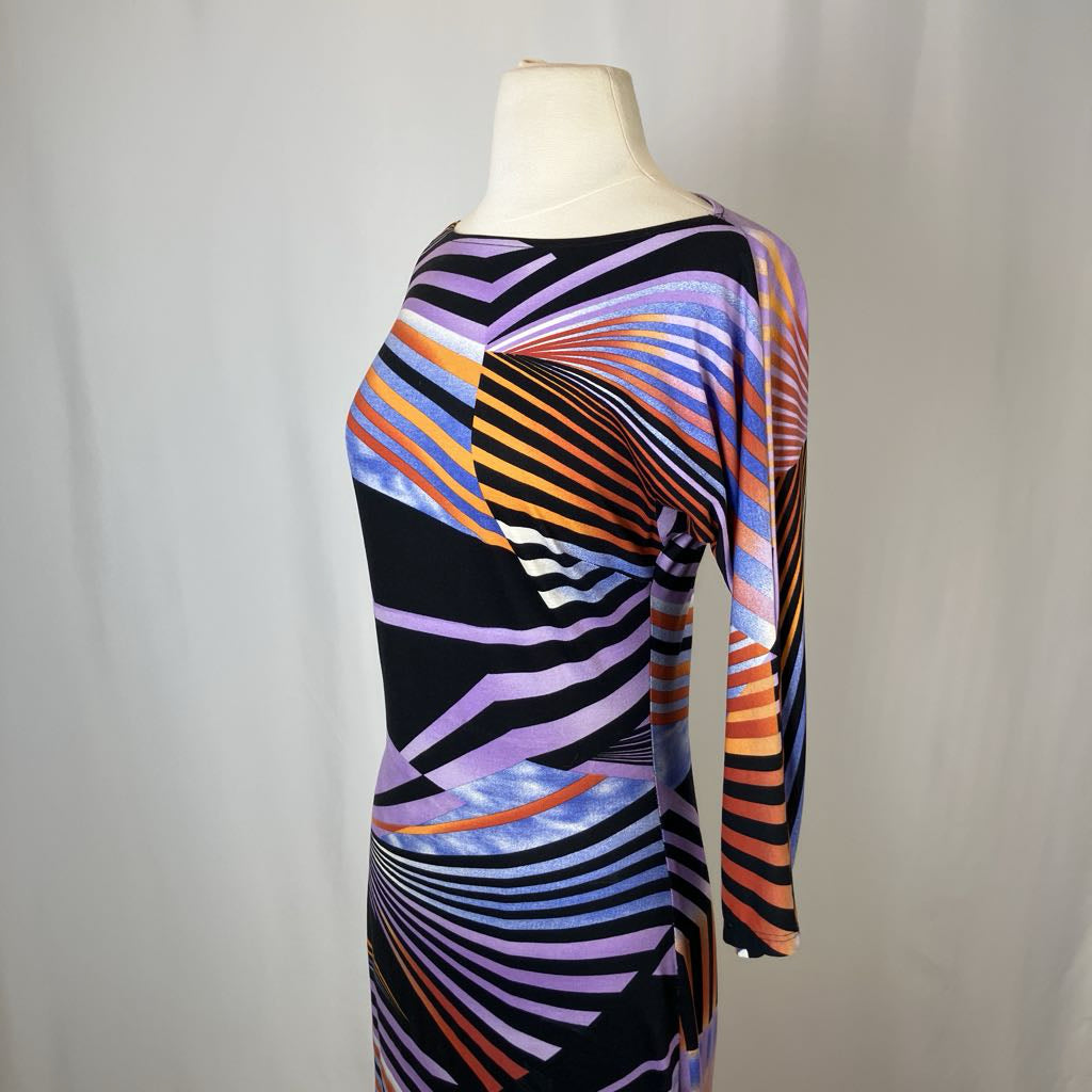 Colorful striped dress on a mannequin against a plain background
