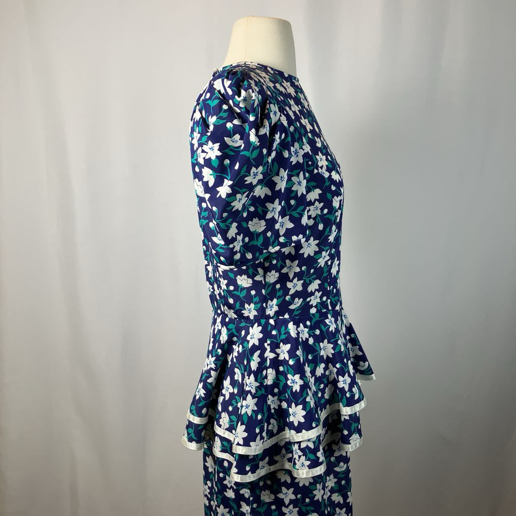 Navy floral dress on a mannequin against a plain background