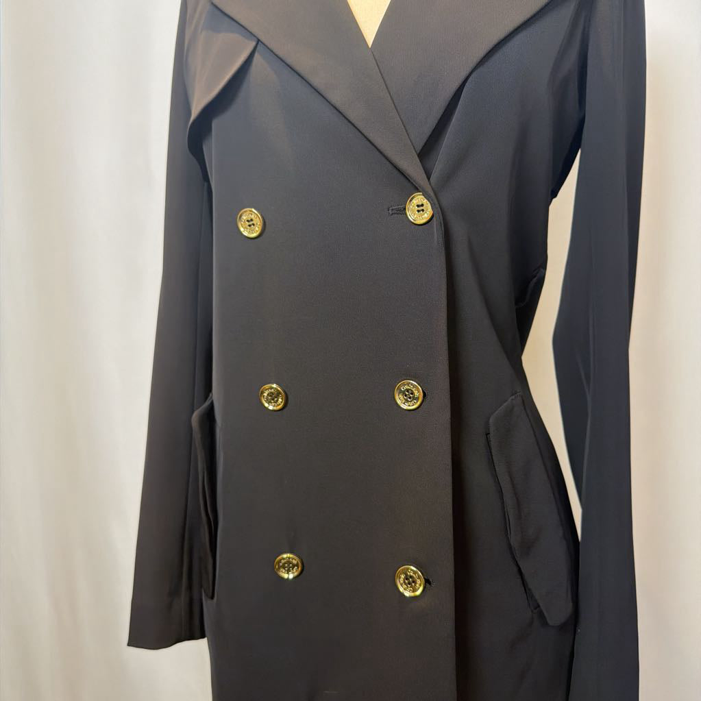 Black coat dress with gold buttons on a plain background