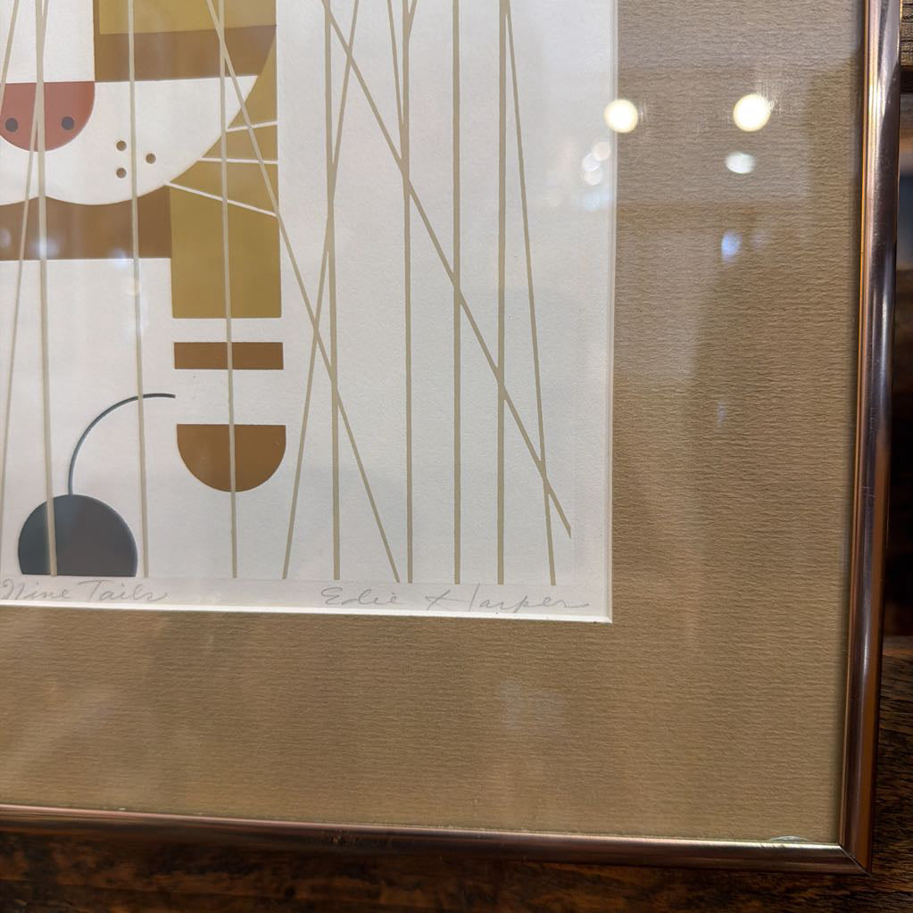 Framed abstract artwork with geometric shapes on a neutral background