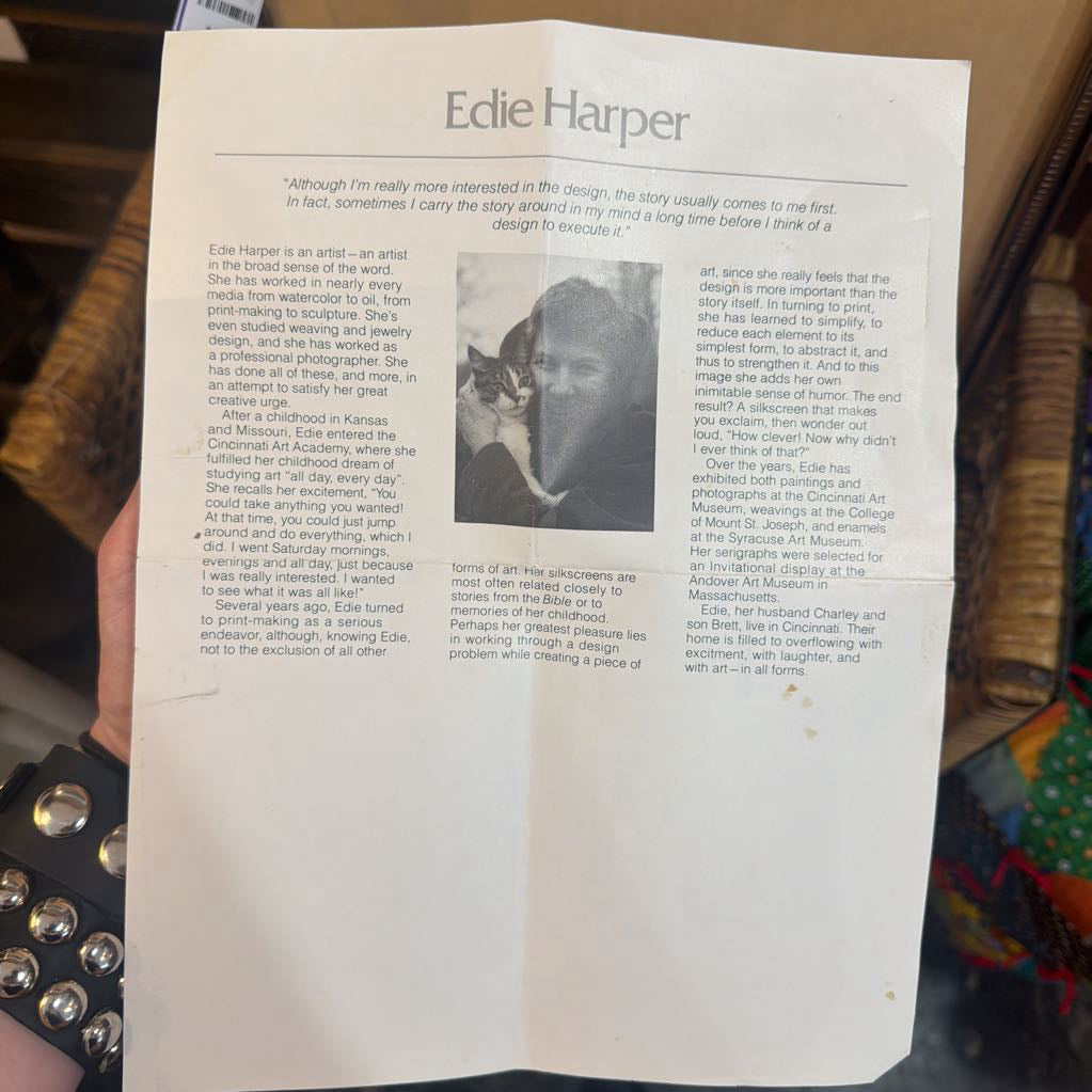 Open book with text and a photo of a person holding a cat, titled 'Edie Harper'.
