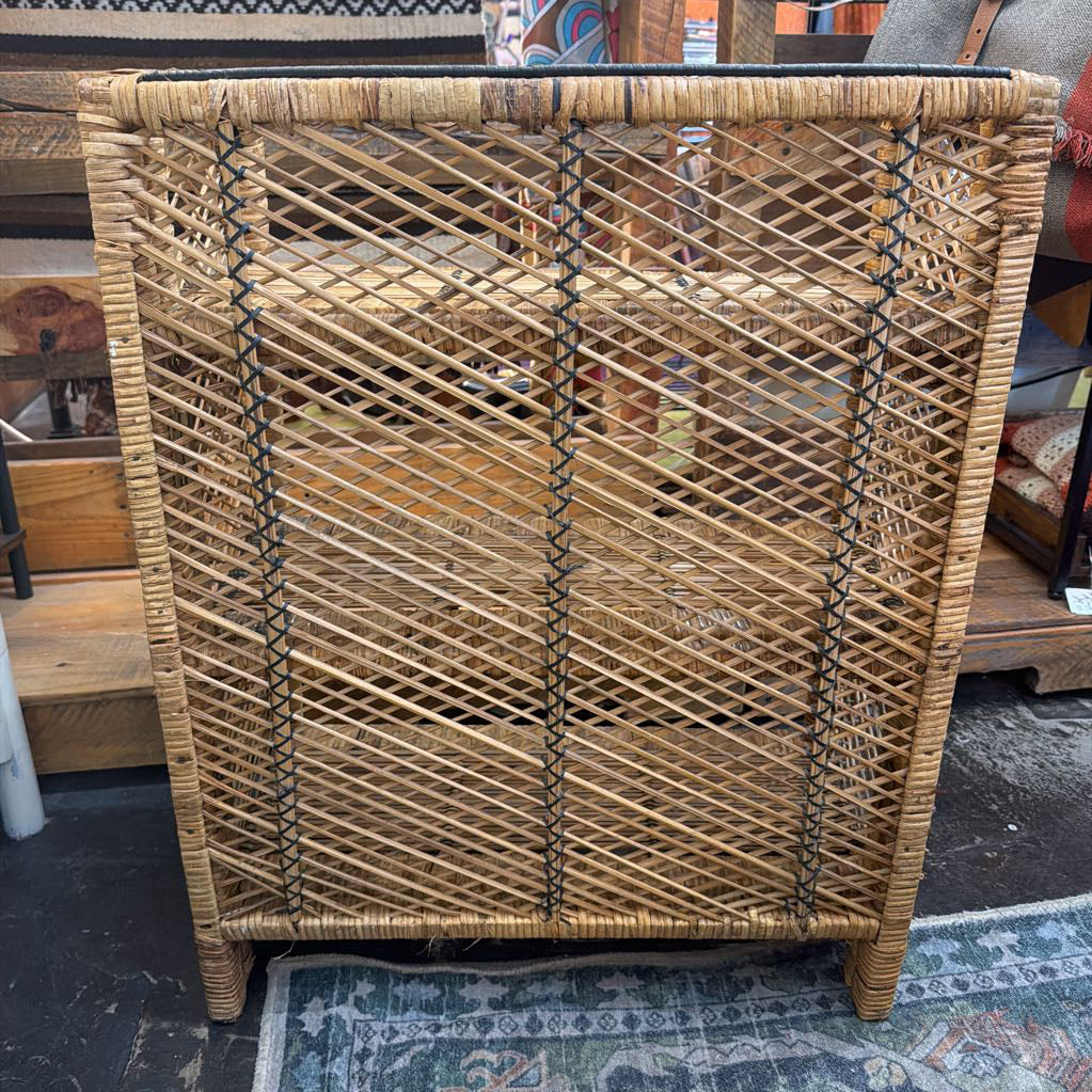Wicker cabinet with a textured surface in an indoor setting
