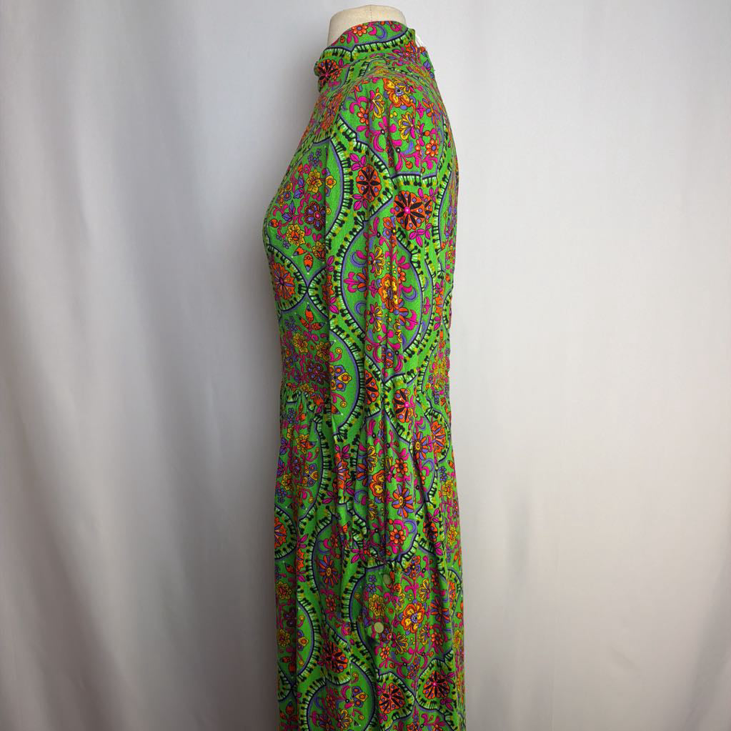 Colorful patterned dress on a mannequin against a plain background