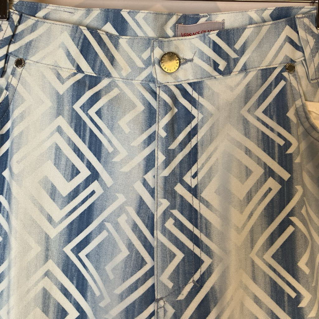 Close-up of a denim skirt with geometric pattern and brand label.