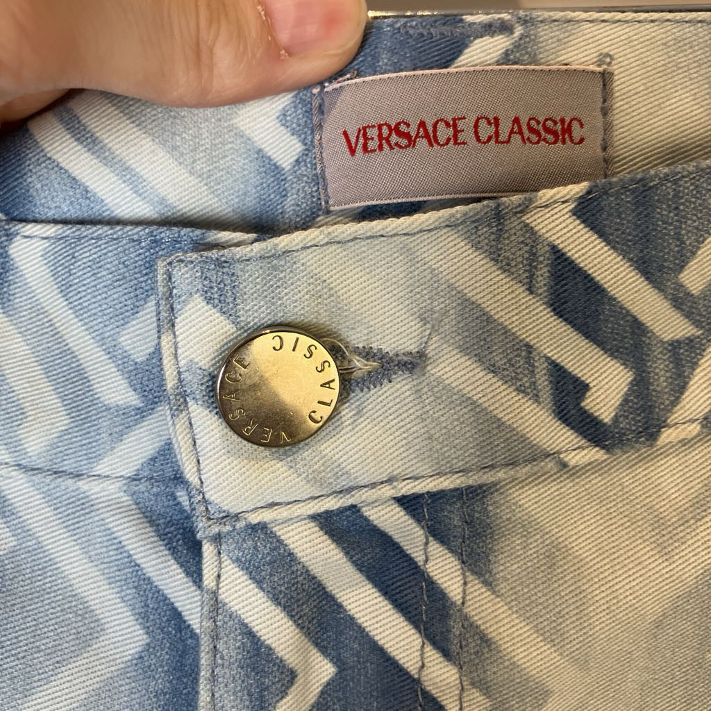 Close-up of Versace Classic label on a patterned fabric