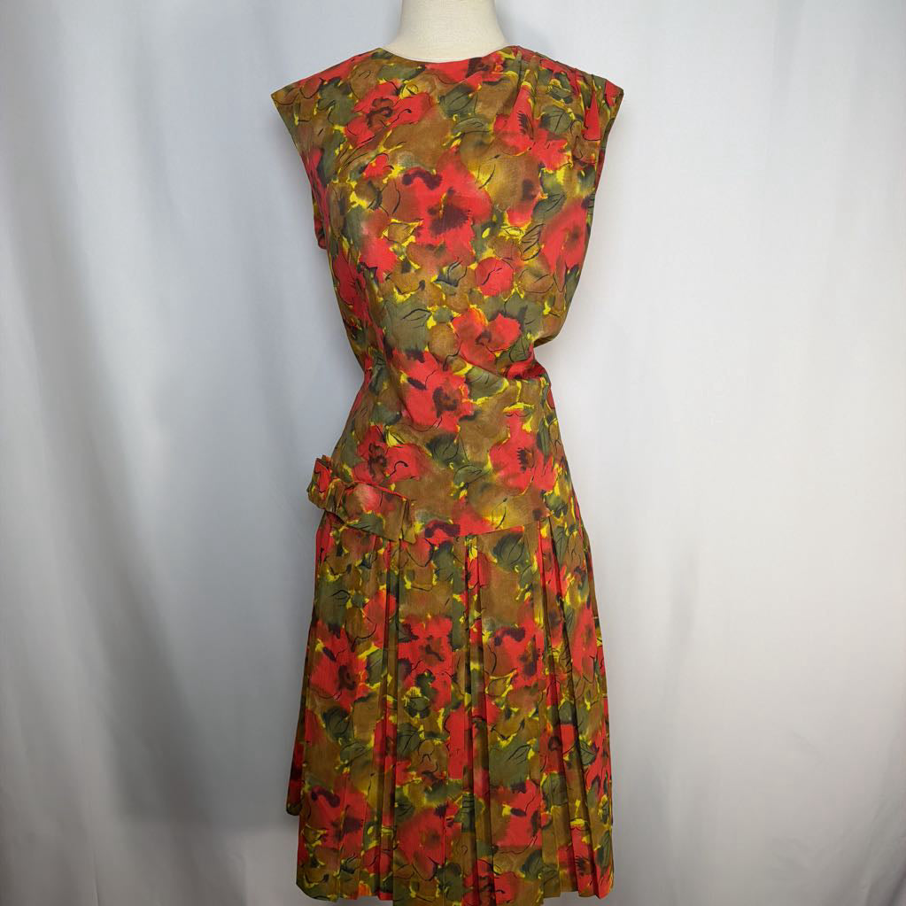 Floral dress on a mannequin against a plain background