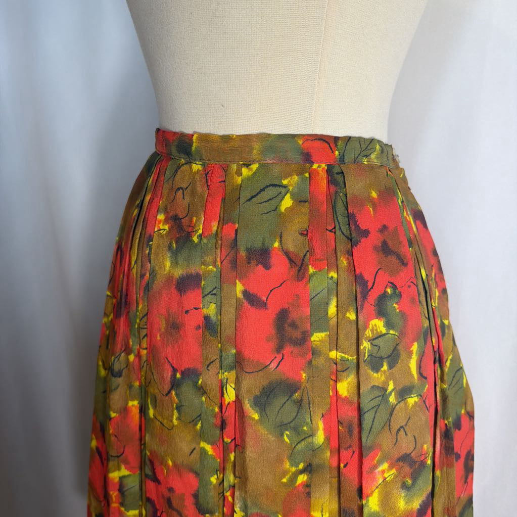 Colorful floral skirt on a mannequin against a white background
