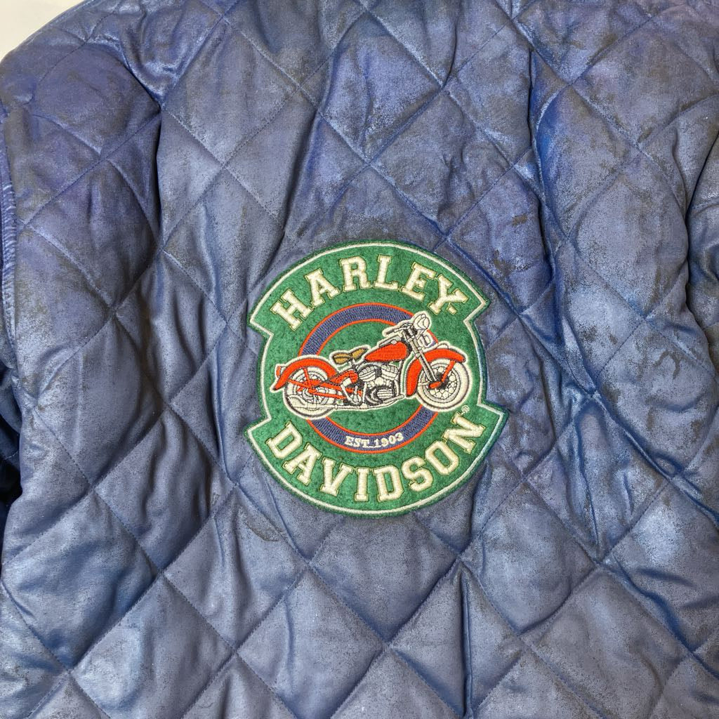 Harley Davidson logo on a quilted blue jacket