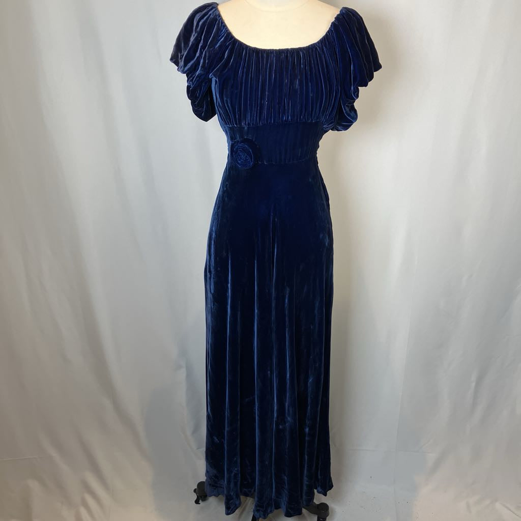 Navy blue velvet dress on a mannequin against a white background