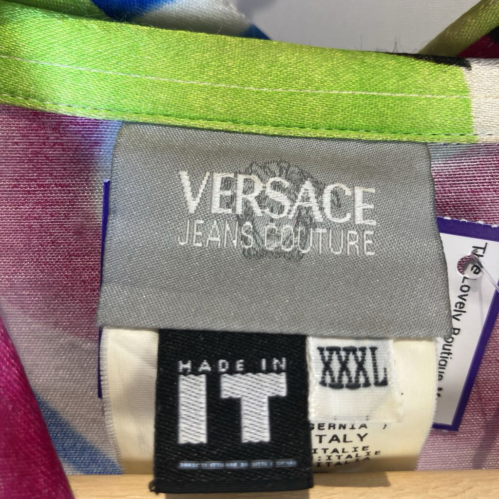 Versace Jeans Couture label on a colorful fabric background