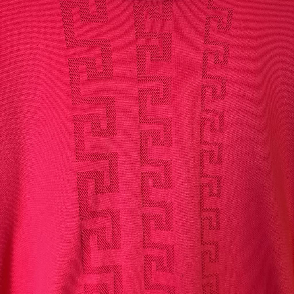 Red fabric with a subtle pattern on a red background