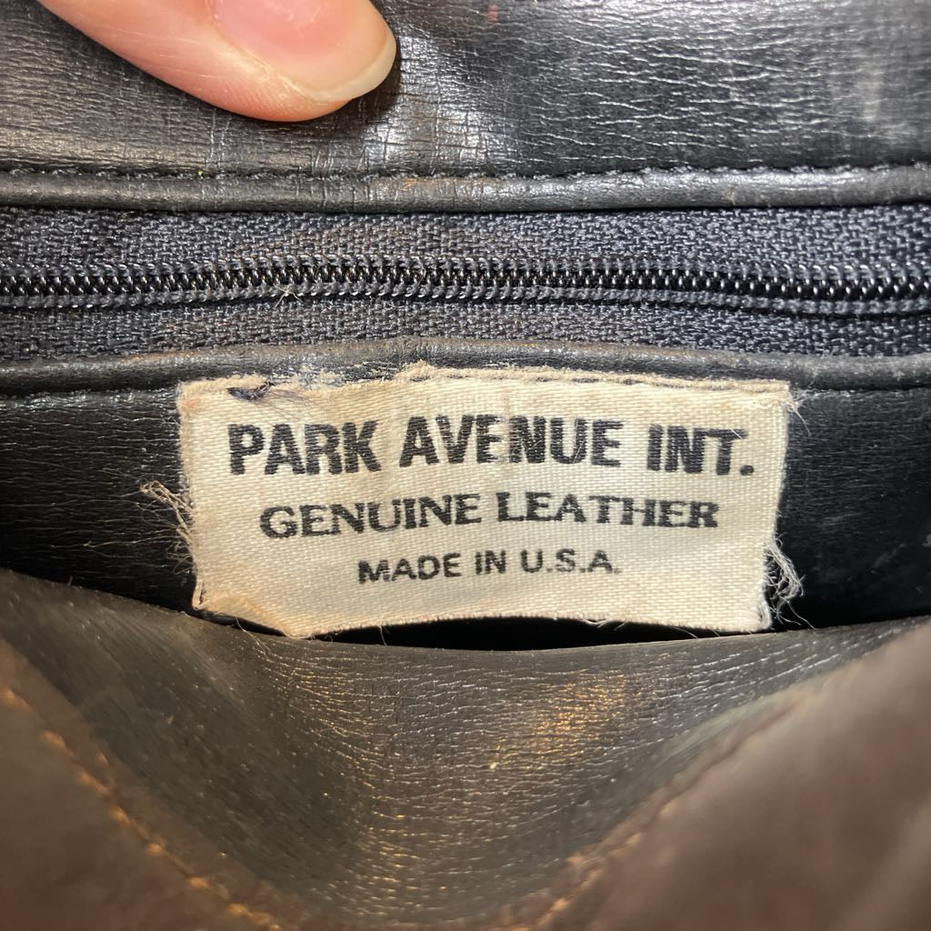 Label on a black leather product indicating 'Park Avenue Int. Genuine Leather Made in U.S.A.'