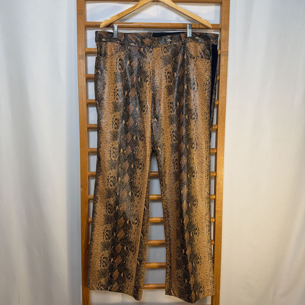 Patterned pants hanging on a wooden hanger against a white background