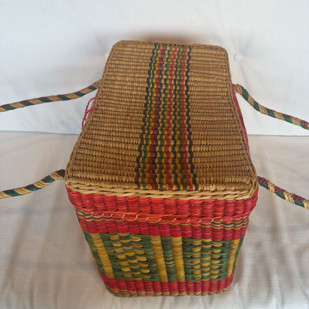 Woven basket with colorful stripes on a white background