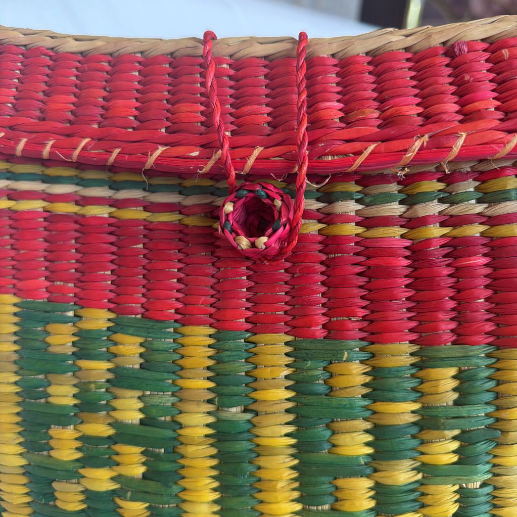 Colorful woven basket with red, yellow, and green pattern