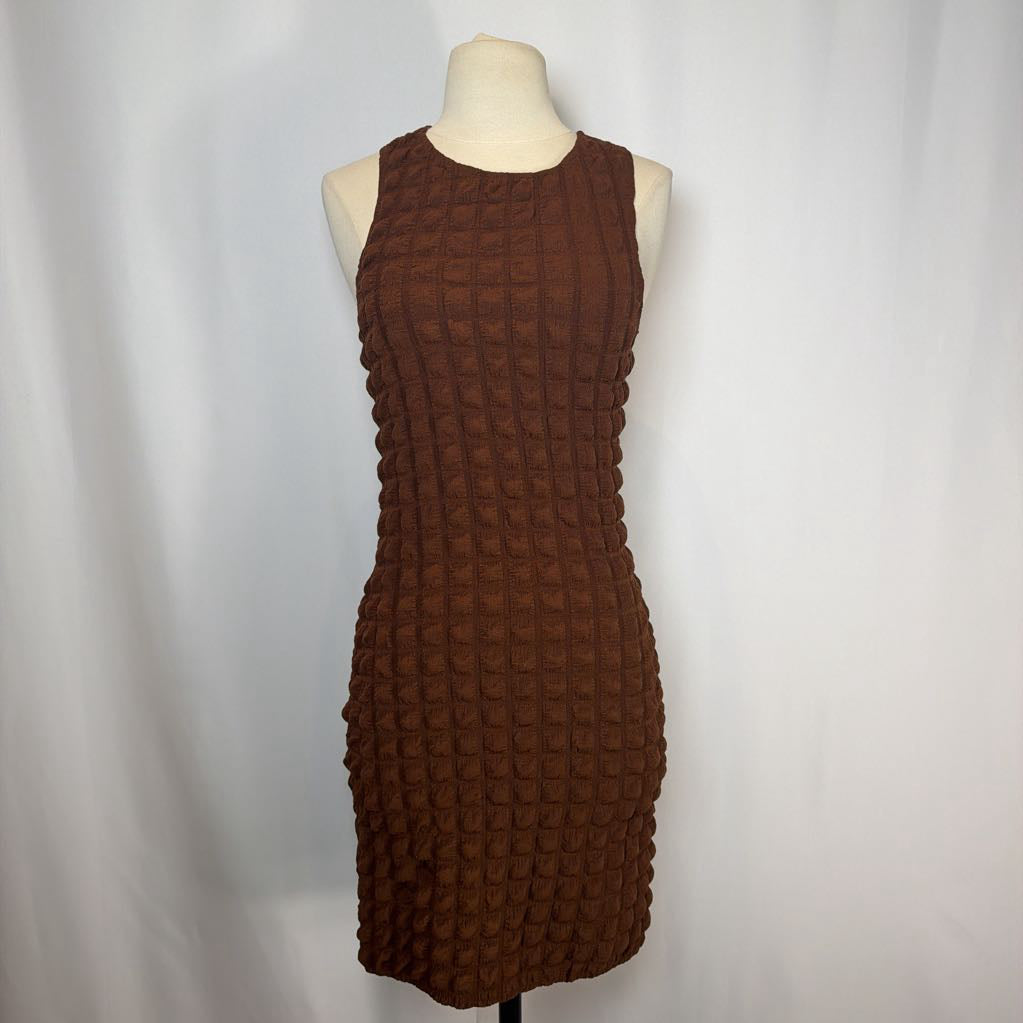 Brown textured dress on a mannequin against a white background