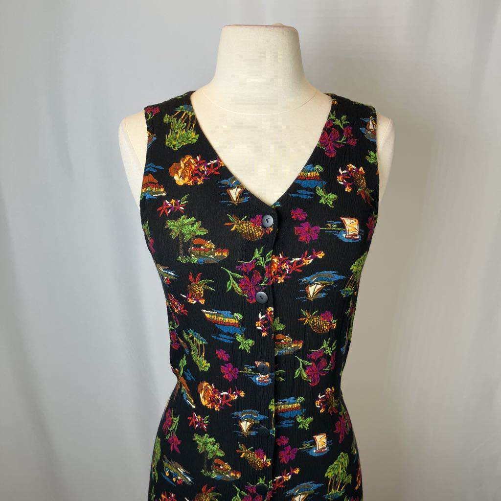 Colorful patterned dress on a mannequin against a plain background