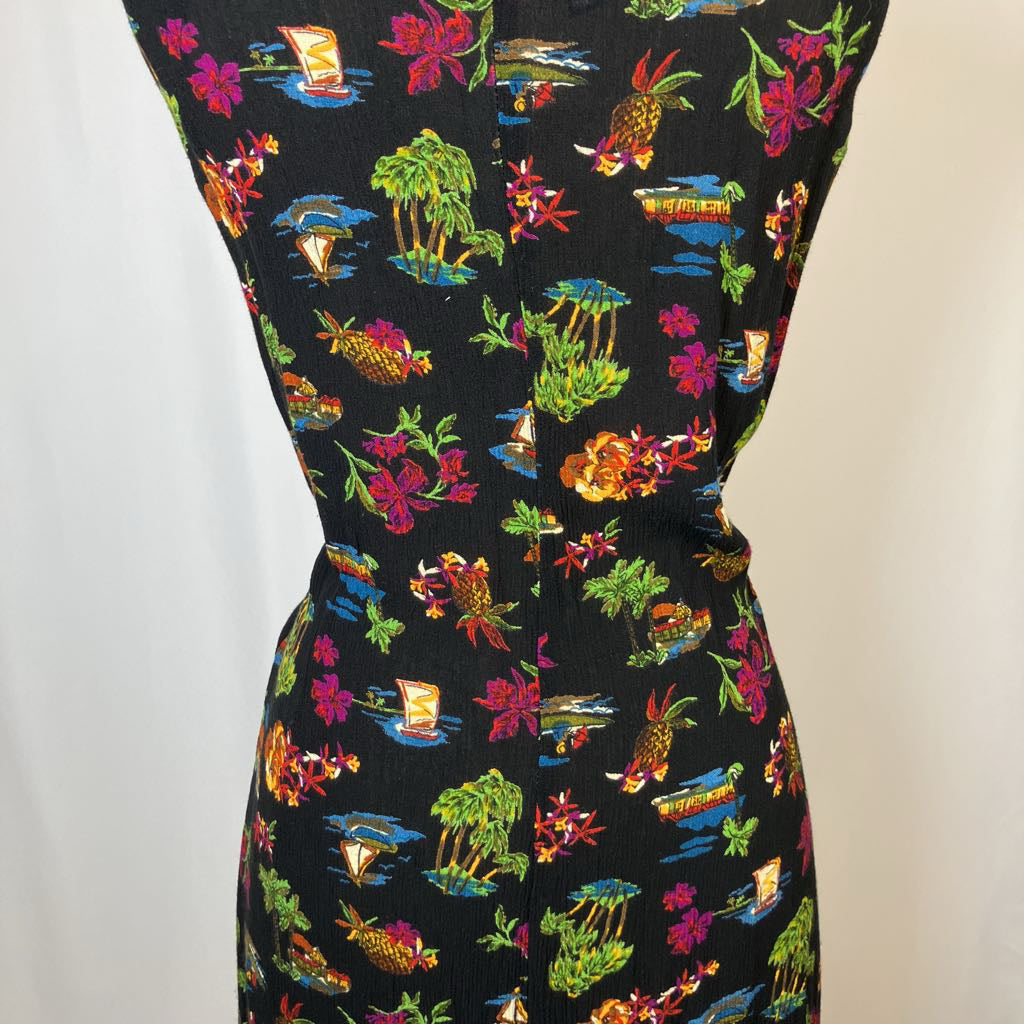 Colorful tropical patterned dress on a plain background