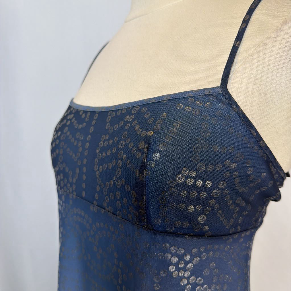 Blue lace dress on a mannequin against a light background