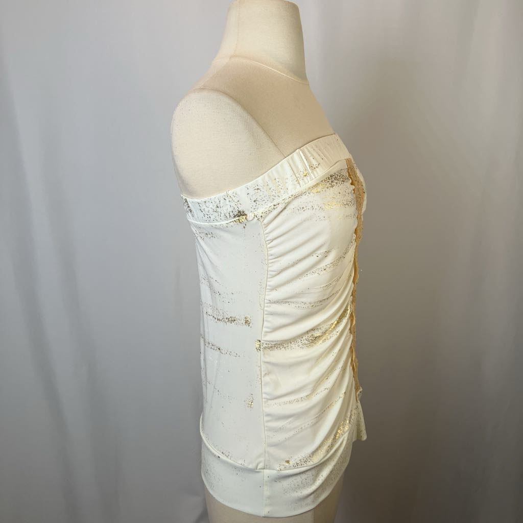 Mannequin wearing a cream-colored strapless top with lace details on a plain background