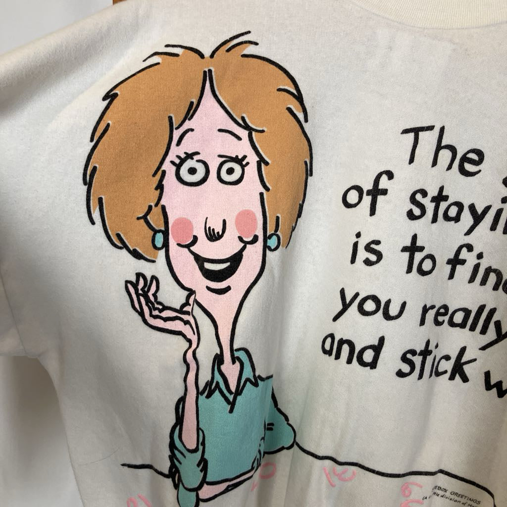 T-shirt with a cartoon character and text on a white background