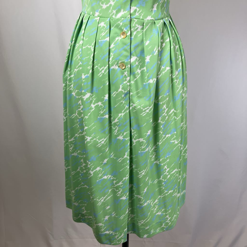 Green dress with abstract pattern on a white background