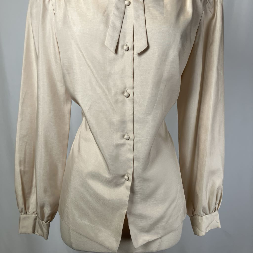 Beige long-sleeve shirt on a gray background