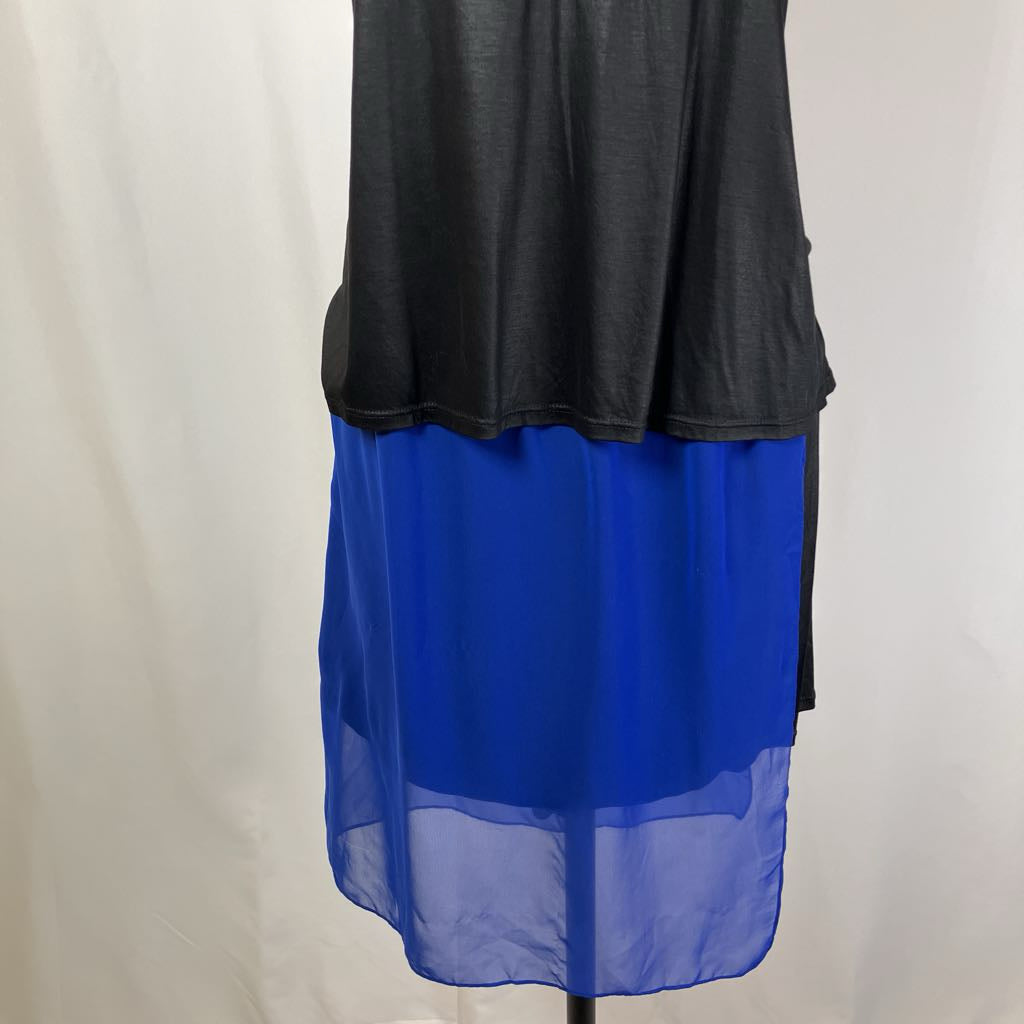 Black top with a blue sheer skirt on a white background